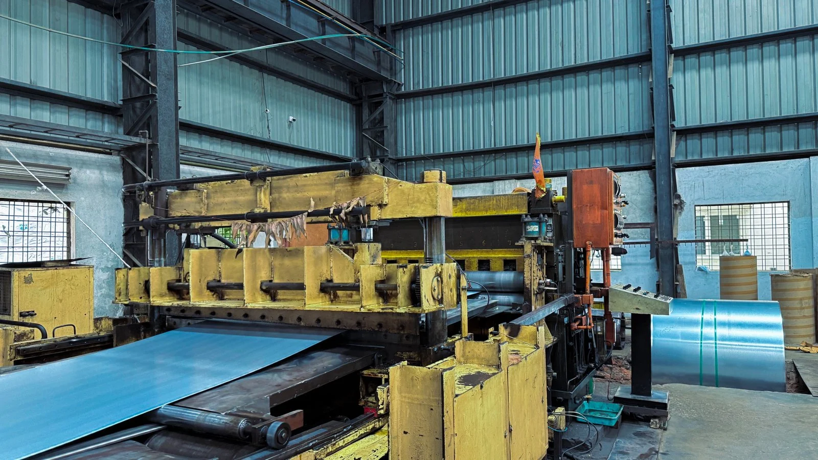 Steel sheet passing through yellow processing machinery